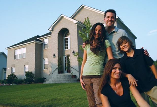 Family in front of a well insulated home