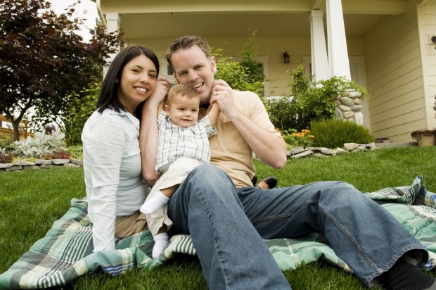 Family in front of a well insualted home